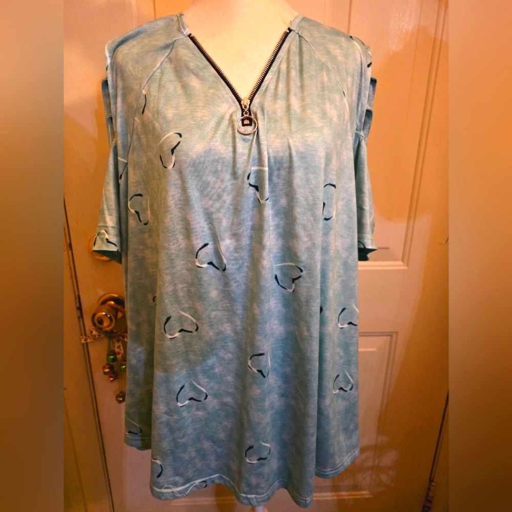 Plus size top with zipper detail.